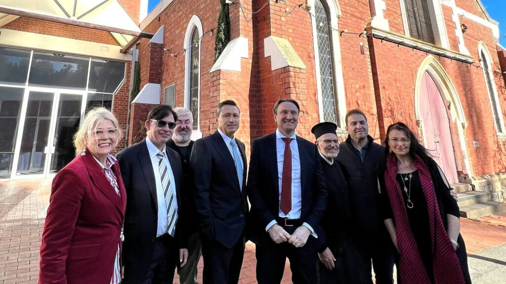 Greek Community of Melbourne representatives outside St Dimitrios Church.